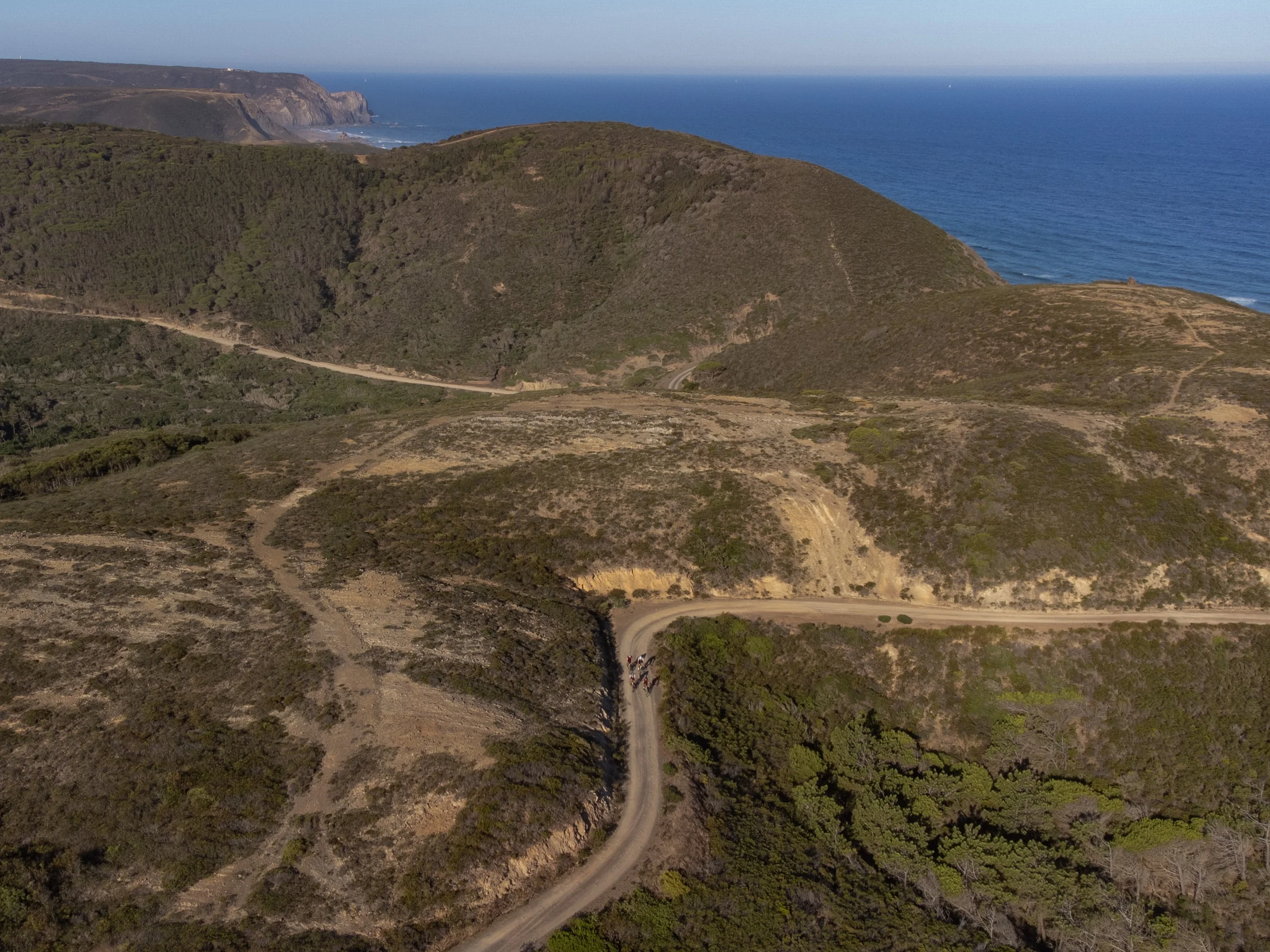 Cliffs and a gravel track above the Atlantic, seen from the air