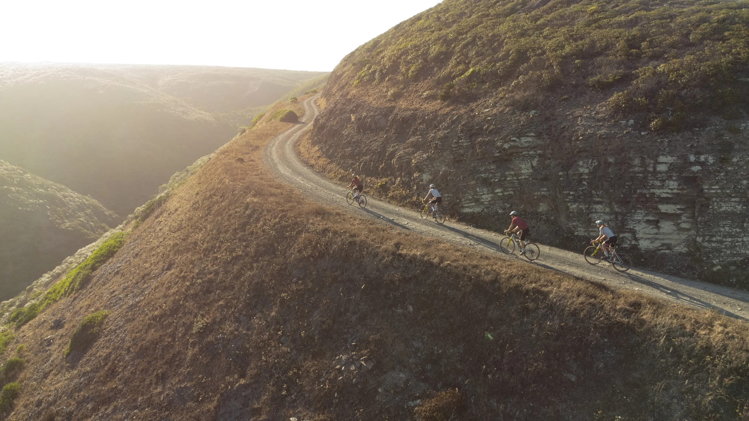 Riders on a ridge track in low sun, Costa Vicentina